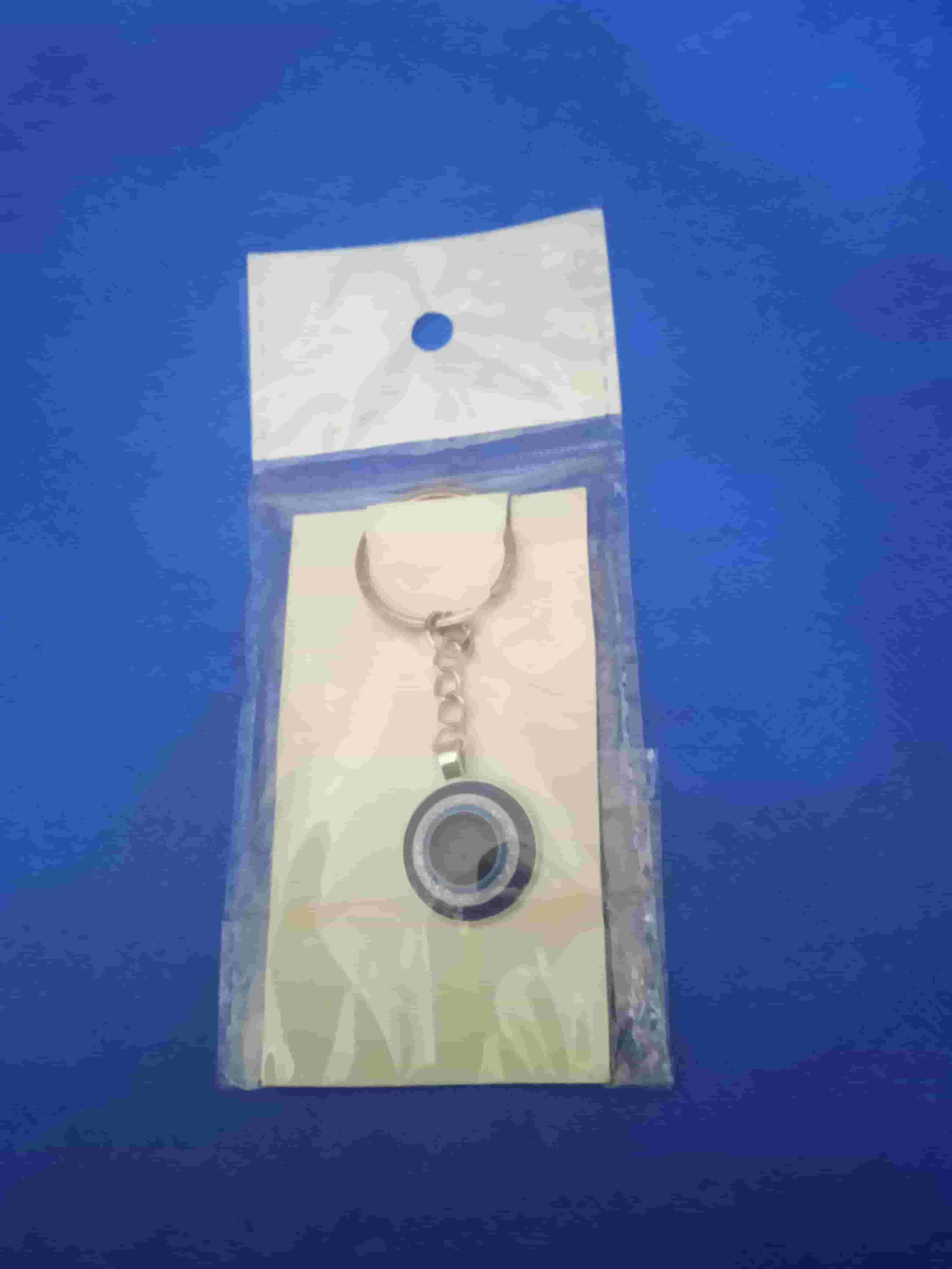 Eye medal with blue beads  