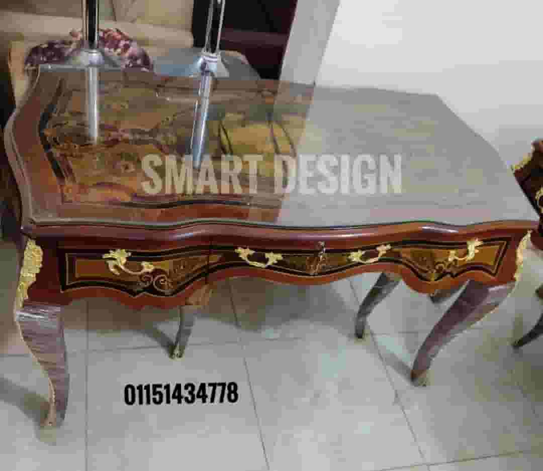 The manager's desk is red beech wood with copper