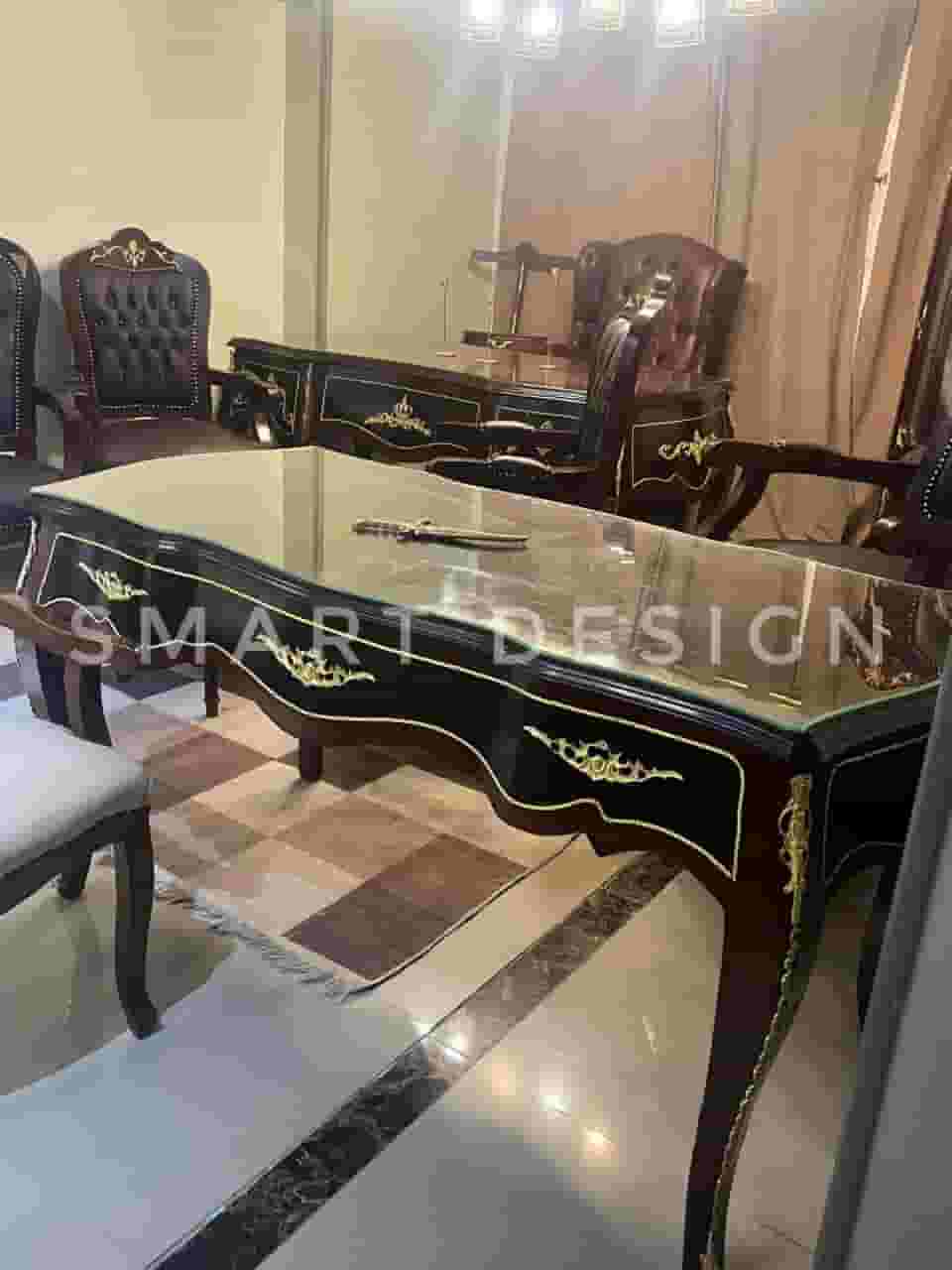 The manager's desk is red beech wood with copper