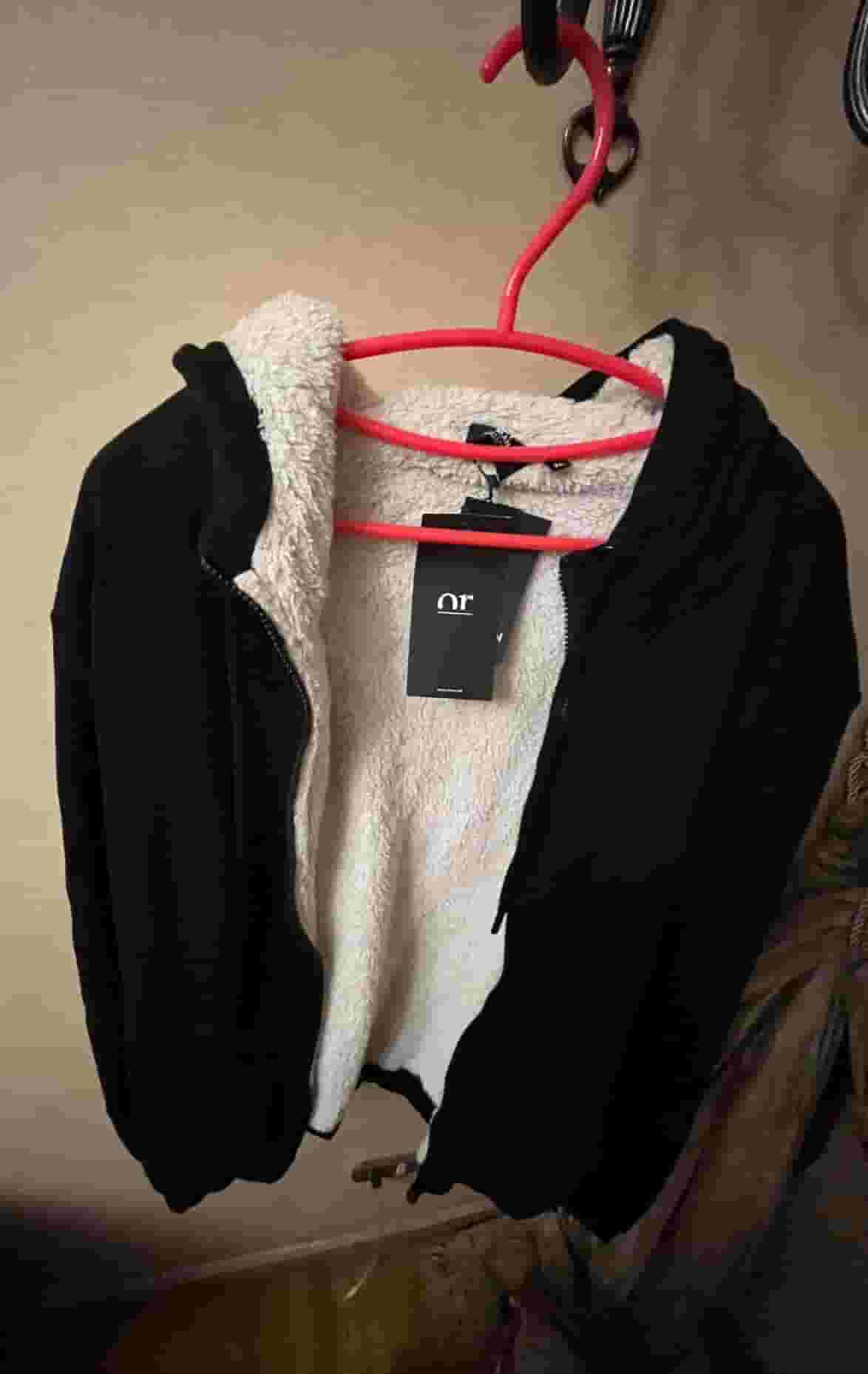 Or men fur lined black hooded cardigan.