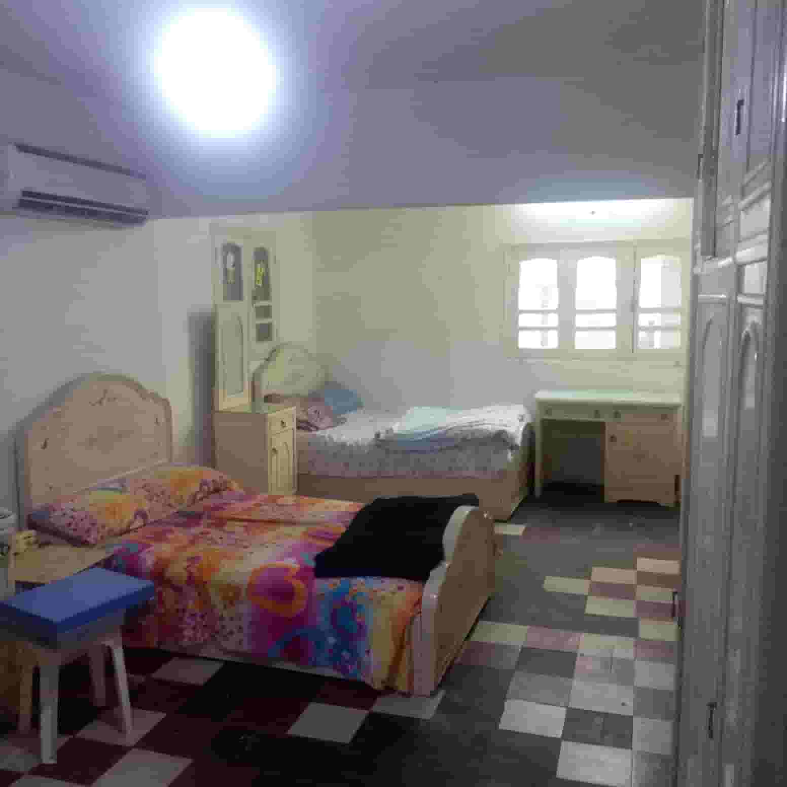 For rent with furniture, an apartment in Al-Shark District, 23rd of July St.