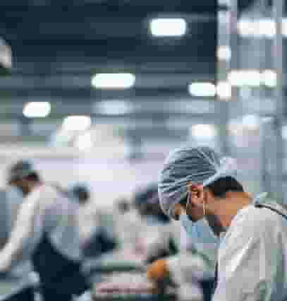 Production worker in a paper printing press