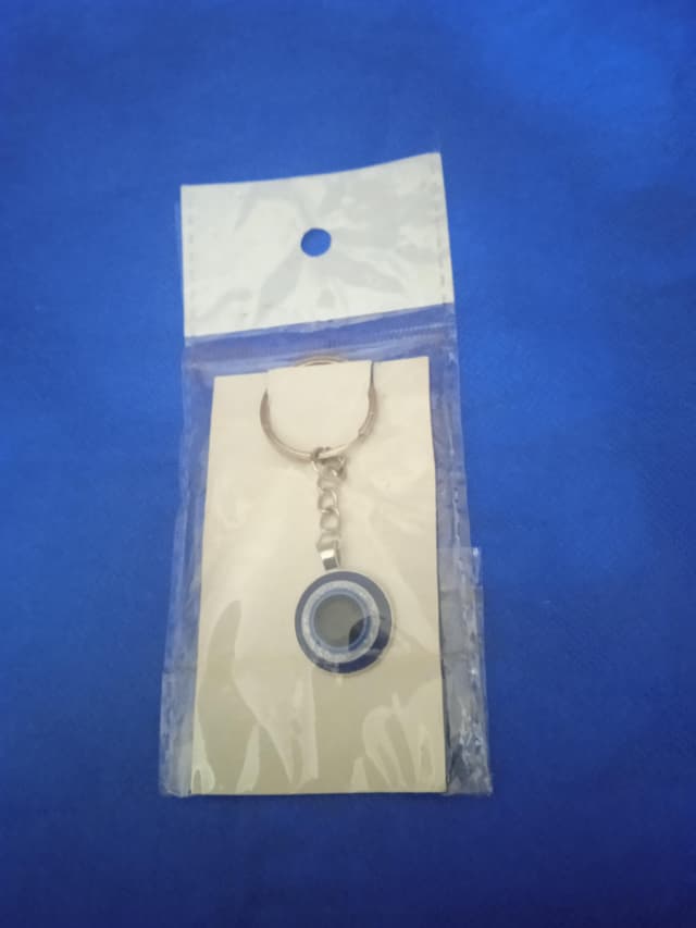 Eye medal with blue beads  